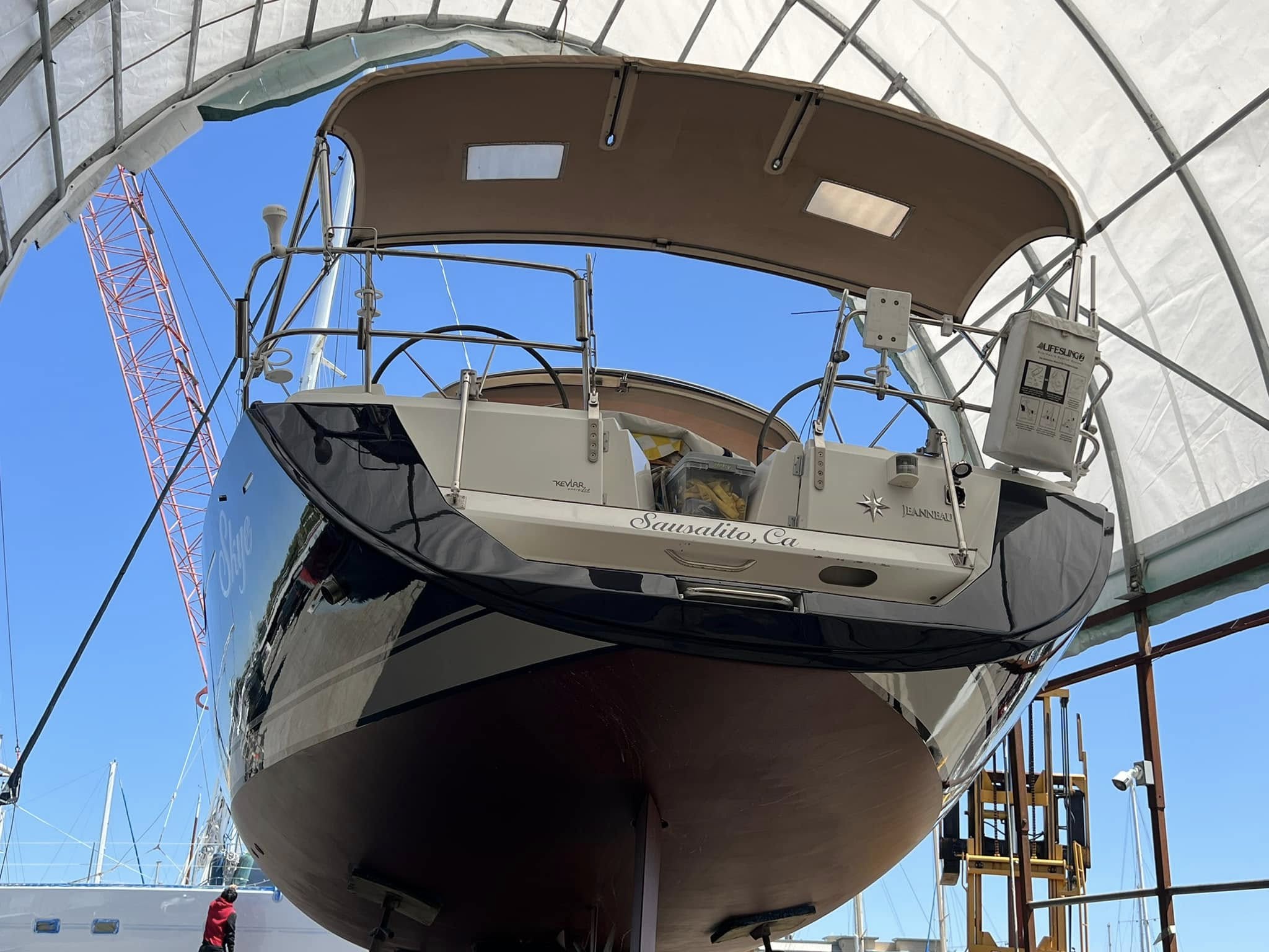Jeanneau Skye on stands in covered work bay